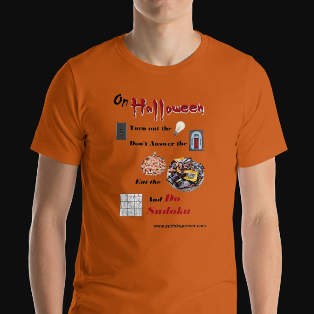 Orange t-shirt with the text 'On Halloween turn out the light, don't answer the door, eat the candy, and do sudoku'